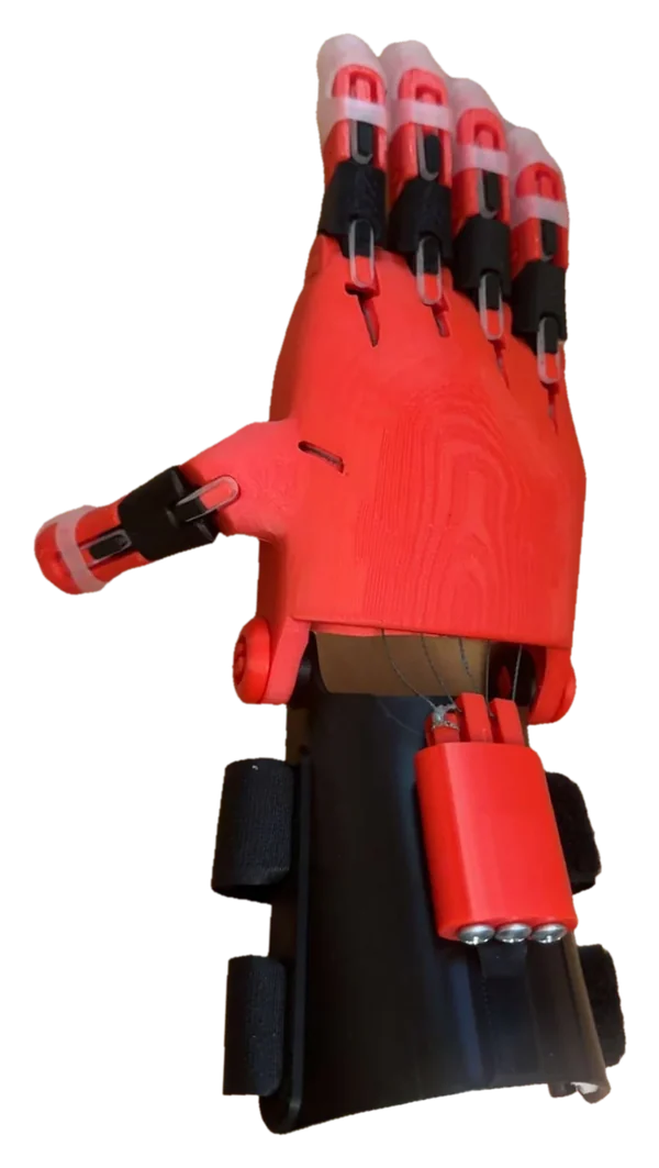 The same prosthetic hand seen from the side, showing the printed palm, the thumb, and the wrist strap