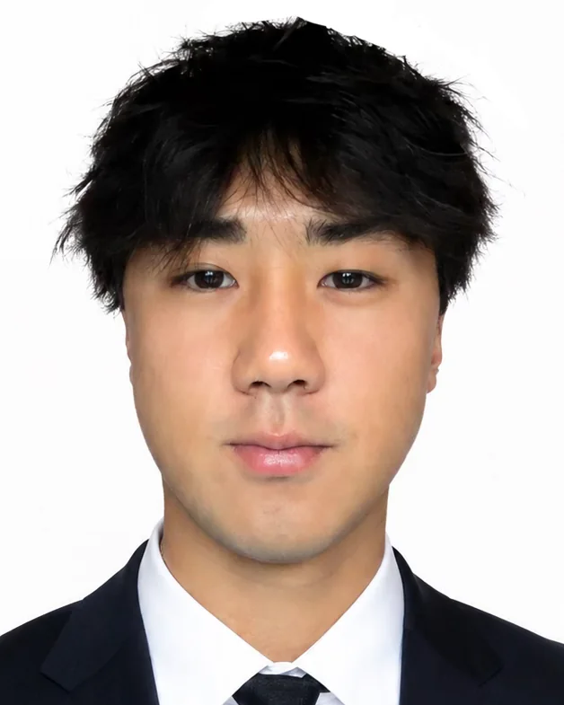 Headshot of Benny Lee in a dark suit, white shirt, and tie