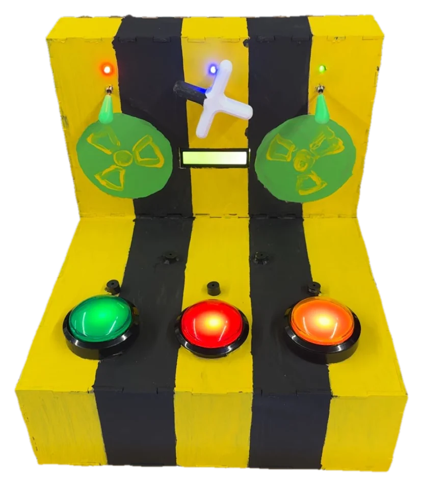 Front view of the reaction game: a yellow and black striped panel with green, red, and orange arcade buttons and two radiation-symbol discs